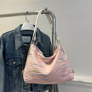Pink quilted hobo shoulder bag with colorful wave embroidery and white leather strap