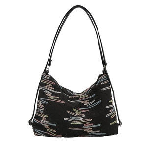 Large capacity soft shoulder bag with rhythmic colorful embroidery on black fabric
