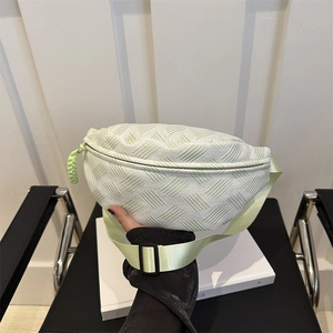 Lightweight mint green fanny pack with textured pattern and adjustable strap for women