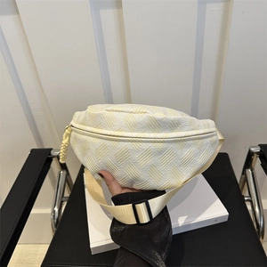Lightweight cream sports waist bag with textured twill fabric and adjustable strap