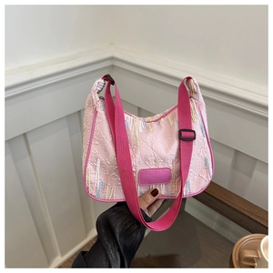 Detail of pink nylon bag with wavy embroidery and embossed double F logo patterns