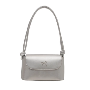 Silver metallic crossbody bag with minimalist bow detail and knotted shoulder strap