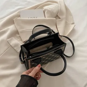 Black quilted embroidery handbag with large interior capacity and multi-layer storage compartments