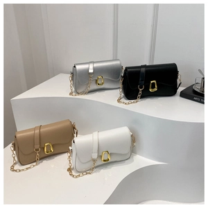 Group display of chic leather crossbody bags in silver, black, khaki, and white on stands
