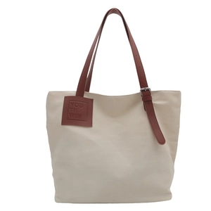 Minimalist canvas tote bag with brown straps and YOUTH WIN leather patch on white background