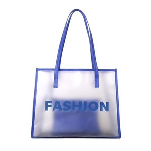 Transparent PVC tote bag with royal blue leather handles and fashion print