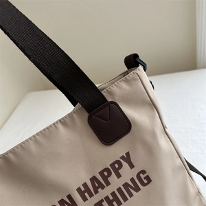 Minimalist canvas tote bag with Happy Thing print and reinforced leather handles