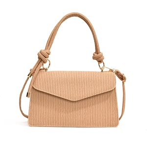 Minimalist beige pleated crossbody bag with knotted handle and gold metal hardware