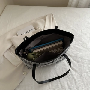 Large mesh tote bag with black trim and spacious interior for tablets and daily essentials