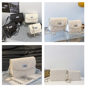 Detail of quilted small square bags with silver hollow twist locks and chain straps