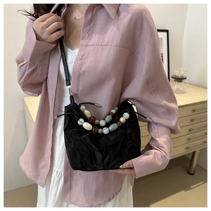 Chic black drawstring bucket bag with decorative colorful agate beads and textured finish