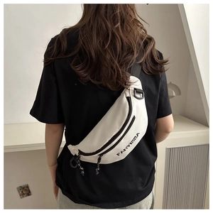 Detail of white nylon fanny pack with black FANYISSA logo and adjustable strap