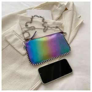 Detail of rainbow gradient laser bag featuring silver beaded edges and fine chain strap