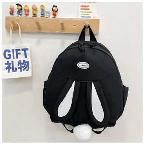 Detailed view of a cute black bunny backpack with long ears and a fluffy tail