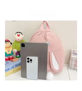 Pink rabbit backpack with long ears showing large capacity for tablet and phone