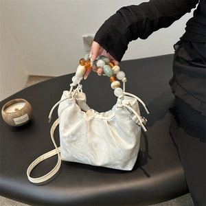 White marble pattern handbag with colorful beads handle and drawstring closure