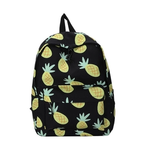 Detail of cute cartoon pineapple pattern on high-capacity black canvas backpack