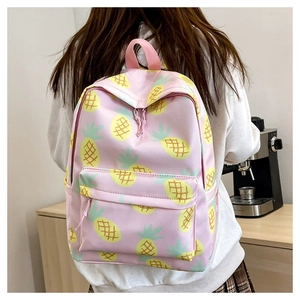 Pink backpack featuring yellow pineapple print with front pocket and zip closure