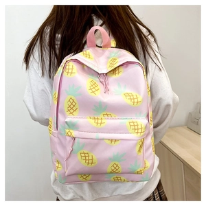 Pink canvas backpack with yellow pineapple pattern shown on model for daily casual wear
