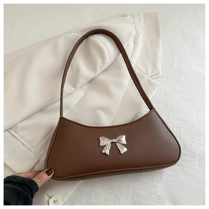 Minimalist brown PU leather crescent shoulder bag with a silver bow decoration