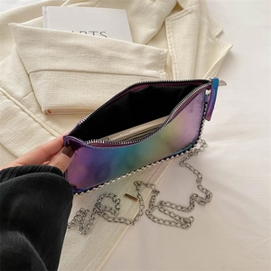 Iridescent laser chain bag with metallic beads and silver strap on white blazer