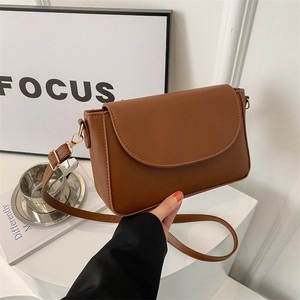 Minimalist brown caramel PU leather square bag with gold hardware and adjustable strap