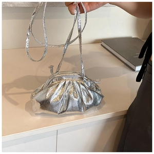 Detailed close-up of metallic silver ruched cloud bag with fine leather texture