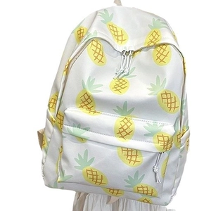 White casual backpack featuring vibrant yellow pineapple patterns and dual zipper pockets