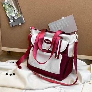 Contrast nylon tote bag in white and burgundy with functional pockets and wide strap