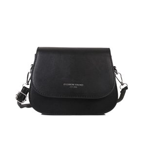 Minimalist black leather saddle crossbody bag with silver lettering and adjustable strap
