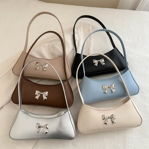 French style bow-knot shoulder bags for women in six stylish colors on a textured background