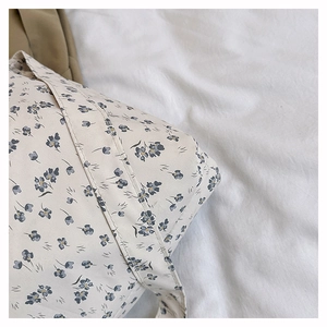 Detailed macro view of floral pattern canvas tote bag with reinforced stitching details