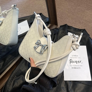 White woven leather underarm bag with large silver metal bow and knotted shoulder strap
