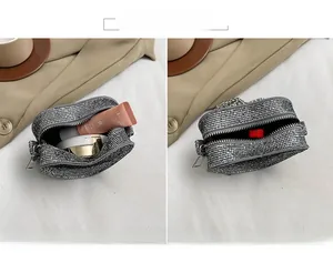 Detailed interior of a heart-shaped silver rhinestone mini bag with chain and card pocket