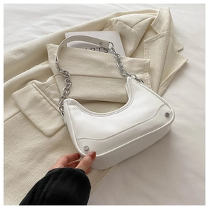 Close-up of white Hobo bag featuring silver chain detail and adjustable leather strap