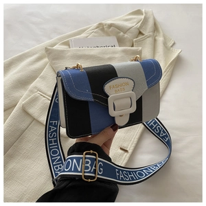 Detail of multi-color canvas crossbody bag with Fashion Bags strap and square buckle