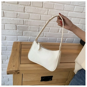 Detail of cream white half-moon underarm bag in smooth synthetic leather