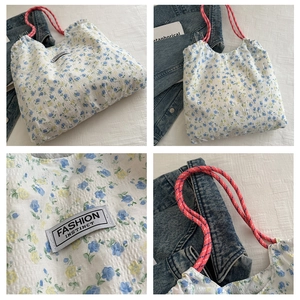 Floral nylon tote bag with drawstring pink rope handles and blue-yellow flower pattern