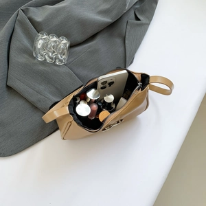 Light brown baguette bag featuring a spacious interior for makeup and a smartphone