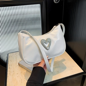 White faux leather crescent hobo bag with a sparkling silver heart metallic buckle