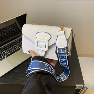 Modern white canvas crossbody bag with blue fashion logo strap and gold hardware