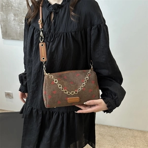 Brown corduroy shoulder bag with red strawberry print and metal flower chain