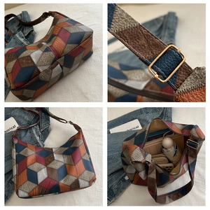 Detail view of large patchwork tote bag showing textured panels and spacious interior