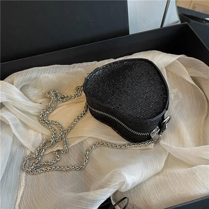 Sparkling black heart-shaped sequin crossbody bag with a delicate silver chain strap