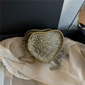 Sparkling heart-shaped evening bag with glitter rhinestones and a silver chain strap
