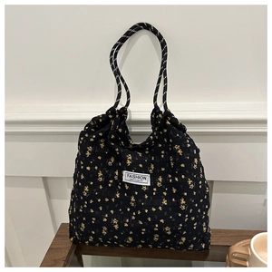 Floral nylon tote bag detail with drawstring handle and Fashion Instinct label