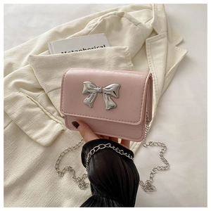 Pink PU leather crossbody bag with silver butterfly buckle and fine metal chain detail