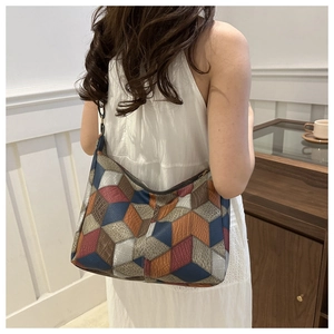 Detail of 3D geometric patchwork tote bag with colorful diamond leather blocks