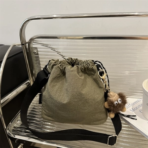 Women Nylon Bucket Crossbody Bag Lightweight Pleated Drawstring Shoulder Purse With Monster Plush Charm Casual Fashion