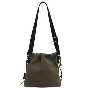 Dark green pleated nylon bucket bag with adjustable black strap and fashion label